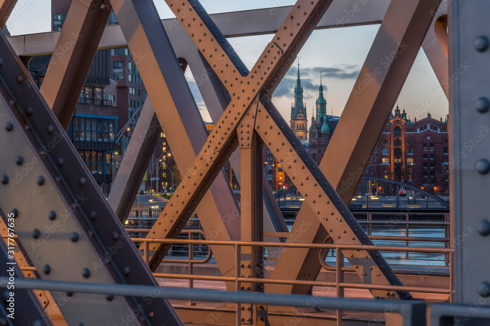 Germany, Hamburg, tower of the townhall and parts of historic warehouse district seen through a frame bridge Germany, Hamburg, tower of the townhall and parts of historic warehouse district seen through a frame bridge