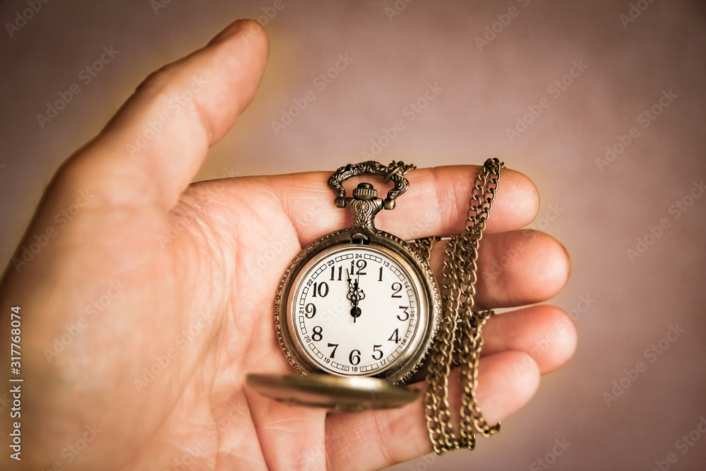 a pocket watch in the hands of a man a pocket watch in the hands of a man