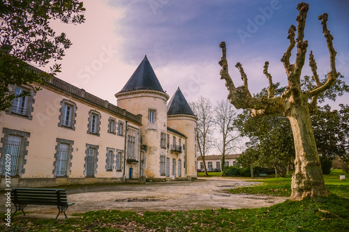 Ancient castle chateau de Thouars in South West of France viewed from the public street in winter. Vintage colors Style.