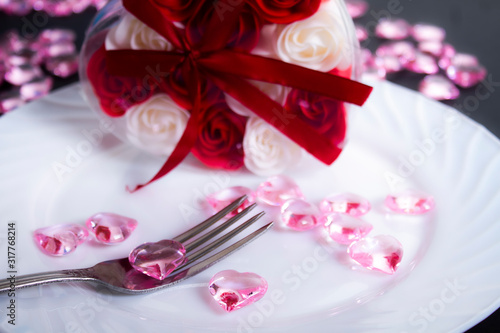 The restaurant table is decorated for a romantic dinner.