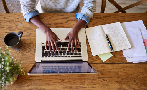 African American female entrepreneur working online at her table