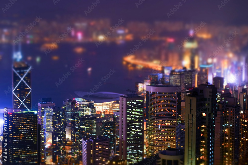 Night futuristic Hong Kong panorama. Tilt shift