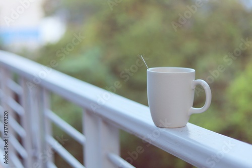 White coffee cup against bl...