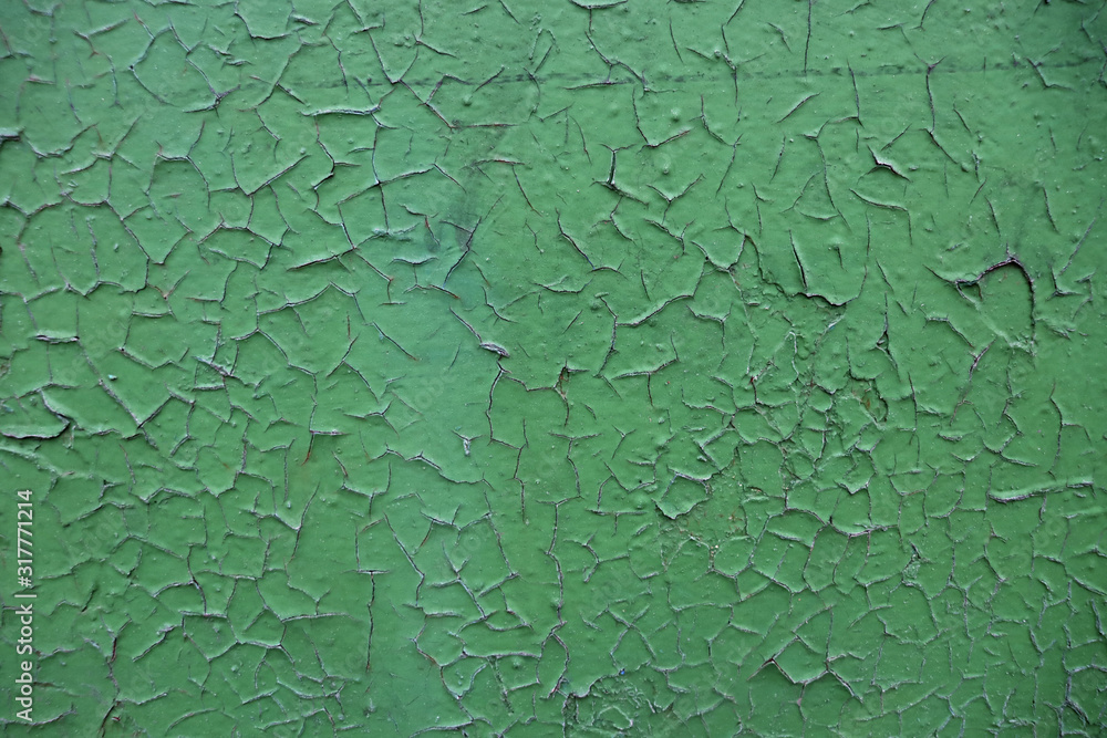 Texture of cracked green old paint. Cracked paint. Texture of cracked green old paint. Cracked paint.