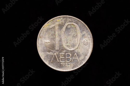 Old Bulgarian copper-nickel 10 leva coin from 1992, reverse isolated on black background photo