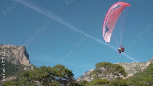 Silhouette Man Paragliding Beautiful Summer Sunset Sky. Paraglide flight experience skydive summer