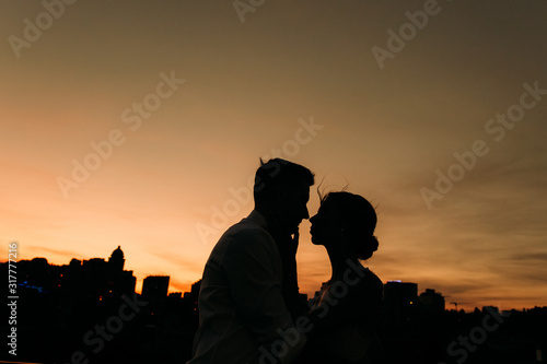 silhouette couple love outside activity night scene