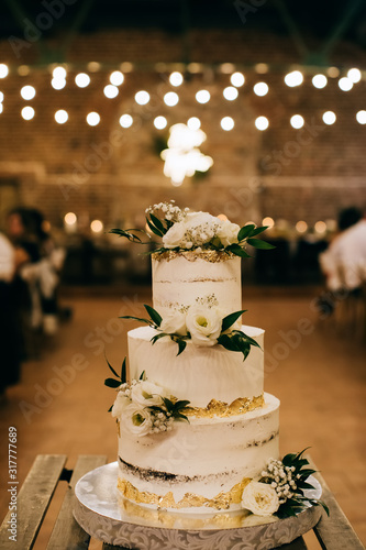 wedding cake with flowers  at a restaurant
