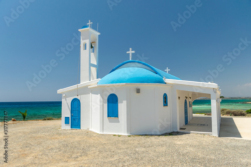 On the seashore is the chapel and cave of Ayia Thekla. photo