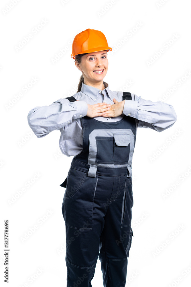 Girl construction engineer gesturing heartily congratulates with the purchase of real estate or quality repairs. Isolated Girl construction engineer gesturing heartily congratulates with the purchase of real estate or quality repairs. Isolated
