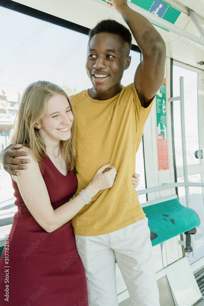Boy-girl couple having a good time on the bus. Boy-girl couple having a good time on the bus.