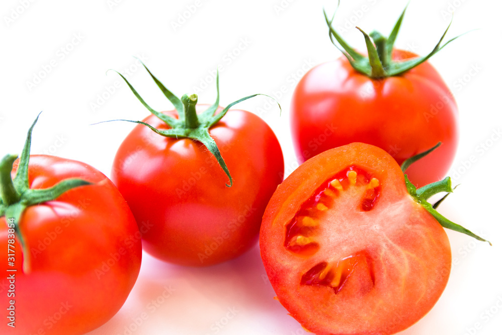 Three delicious ripe red tomatoes and a slice on white background. Side view. Healthy and organic food concept. Agriculture and harvesting. Vegetable store in supermarket. Illustration for price tag. Three delicious ripe red tomatoes and a slice on white background. Side view. Healthy and organic food concept. Agriculture and harvesting. Vegetable store in supermarket. Illustration for price tag.