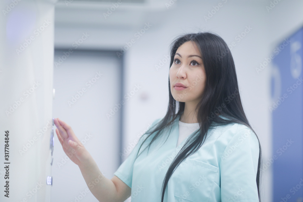 asia woman nurse checking device in a hospital asia woman nurse checking device in a hospital