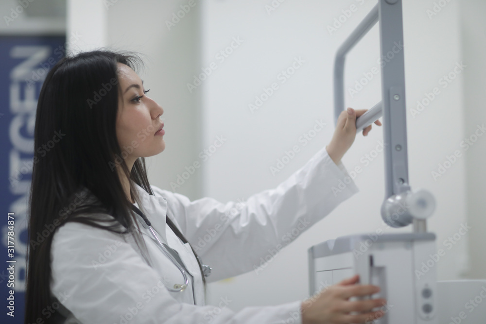 asia woman doctor checking device in a hospital asia woman doctor checking device in a hospital