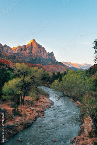 River flowing in a rocky landscape with mountains in the background