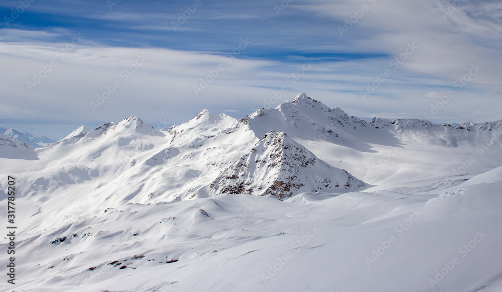 Snowy Mountains in blue and white sky Snowy Mountains in blue and white sky
