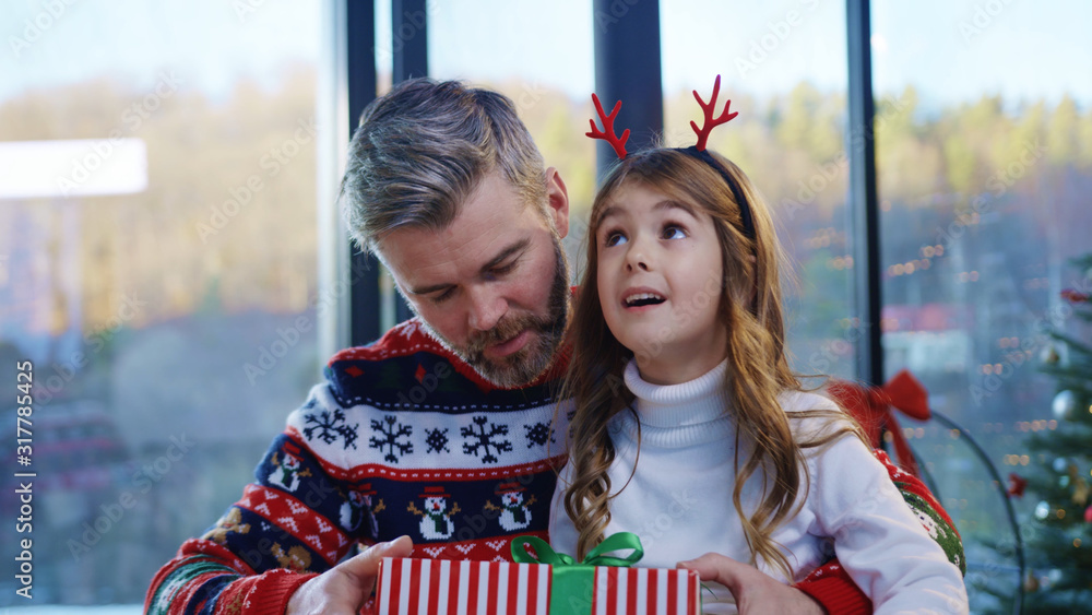 happy-bearded-father-hugging-and-giving-christmas-present-to-his