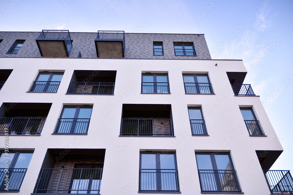 Obraz premium Modern and new apartment building. Multistoried, modern, new and stylish living block of flats.
