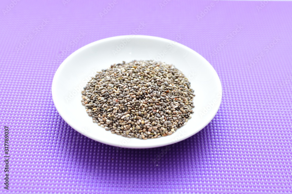 Chia seeds in colorful background Chia seeds in colorful background