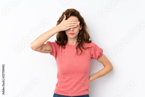 Young pretty woman over isolated background covering eyes by hands. Do not want to see something