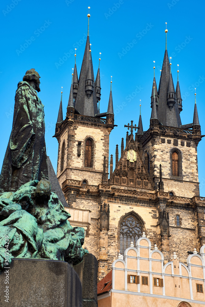 Monument in front of St Mary Tyn church in Prague on a bright day with blue sky. Prague, Czech Republic, architecture background