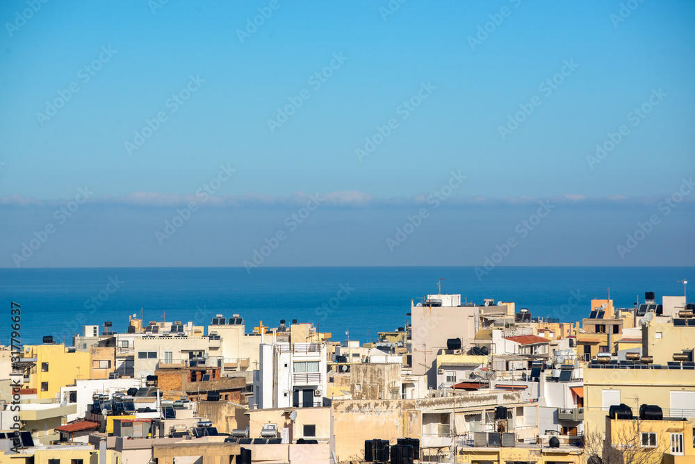 Heraklion, Crete panorama - town yellow bulidings and blue sea horizon.
