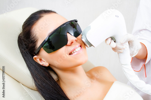 Fotografi Close-up of laser hair removal of a mustache on a female face.