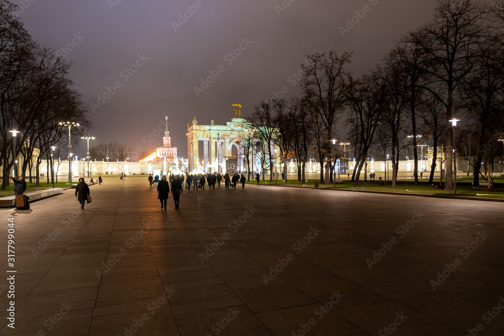 New Year's and Christmas light sculptures in the square and festive illumination of the arch of the Main entrance of VDNKh, Moscow, Russian Federation, December 13, 2019