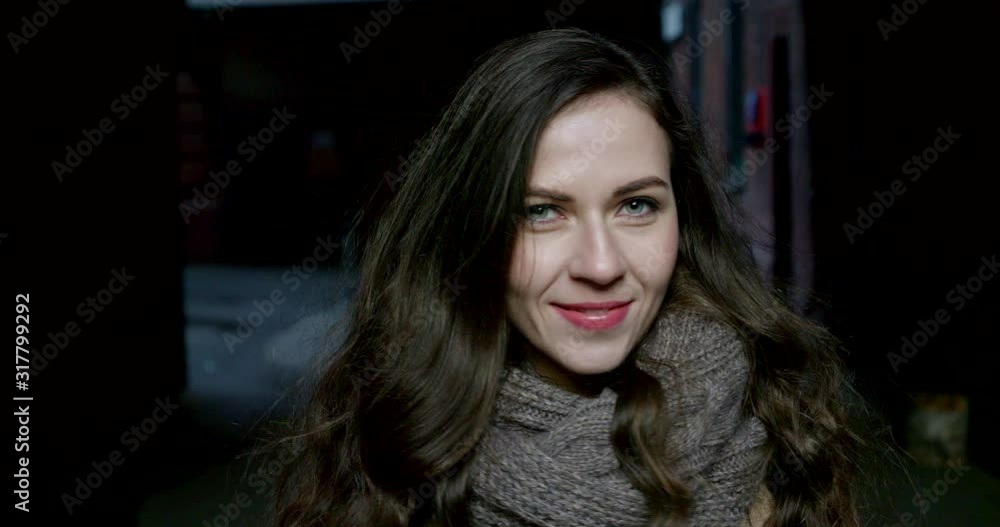 girl with large knitted scarf poses on backstreet closeup girl with large knitted scarf poses on backstreet closeup