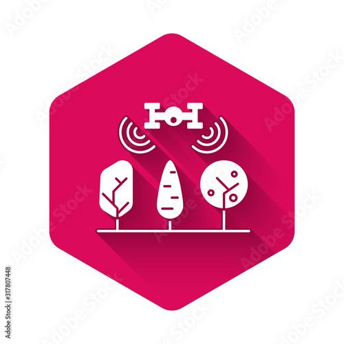 White Smart farm with drone control and tree icon isolated with long shadow. Innovation technology for agricultural company. Pink hexagon button. Vector Illustration