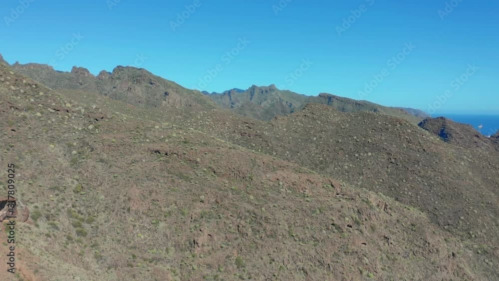 Aerial view. Beautiful landscape of green mountain range. Panoramic view of mountains range on island of Tenerife, Spain. Aerial view. Beautiful landscape of green mountain range. Panoramic view of mountains range on island of Tenerife, Spain.