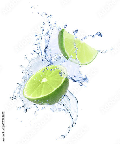 Ripe limes and splashing water on white background