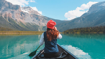 Papier peint photo Canada Kayaking around Emerald lake in Banff Canada  © AMVShutter