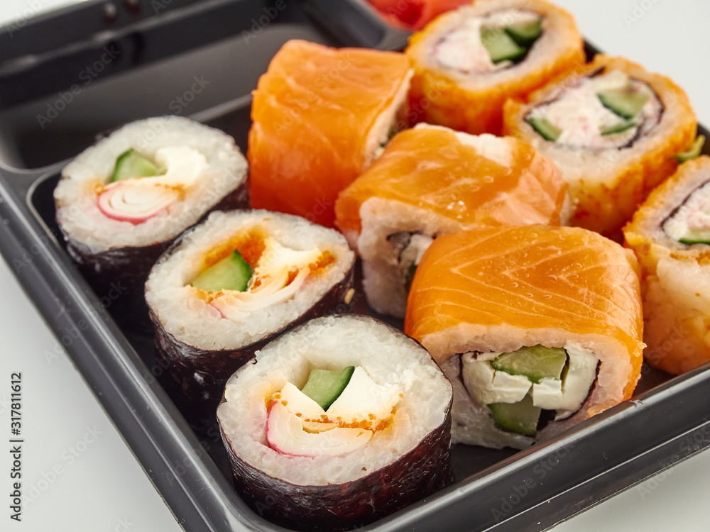 California rolls in a disposable container, fast food.Isolate white background California rolls in a disposable container, fast food.Isolate white background
