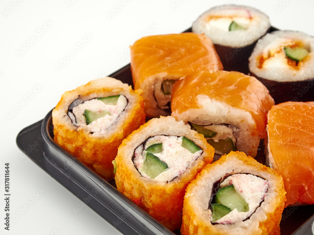 California rolls in a disposable container, fast food.Isolate white background California rolls in a disposable container, fast food.Isolate white background