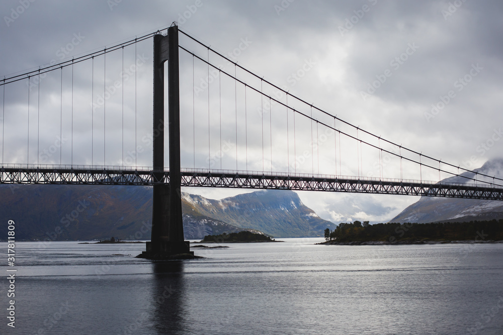 Fototapeta premium Classic Norwegian cold panoramic landscape of Efjorden fjord, Ballangen municipality, Nordland county, Ofoten district, Norway with Efjord Bridges, Stortinden mountain, Northern Norway