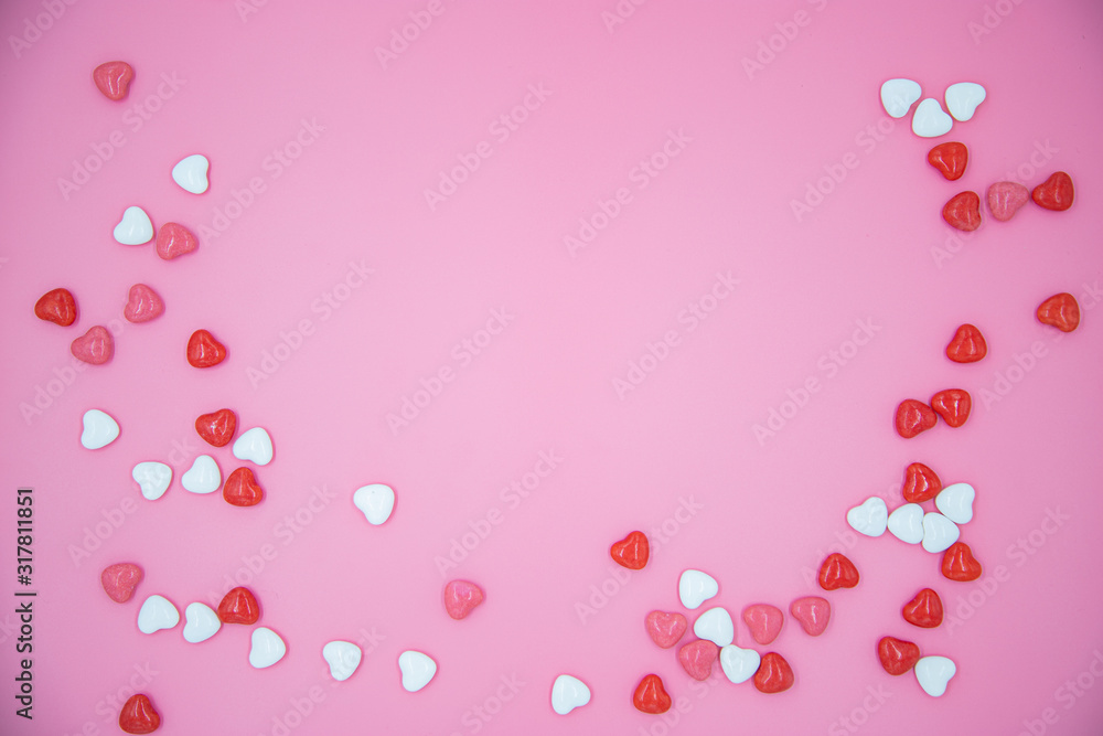 Heart shape candy on pink background. Valentines day concept. 