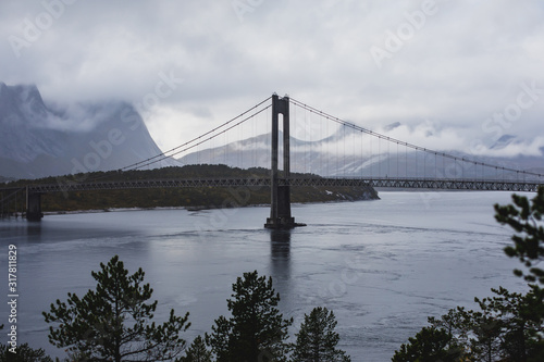 Classic Norwegian cold panoramic landscape of Efjorden fjord, Ballangen municipality, Nordland county, Ofoten district, Norway with Efjord Bridges, Stortinden mountain, Northern Norway