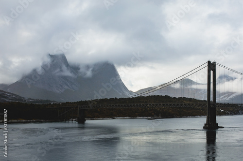 Classic Norwegian cold panoramic landscape of Efjorden fjord, Ballangen municipality, Nordland county, Ofoten district, Norway with Efjord Bridges, Stortinden mountain, Northern Norway photo