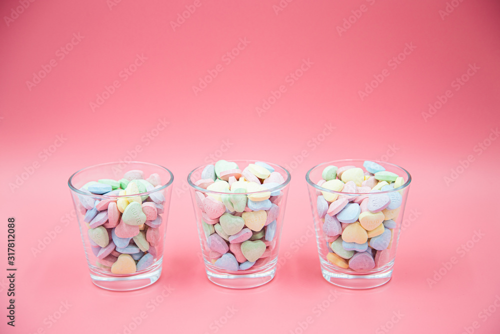 Heart shape message letter candy on pink background. Valentines day concept. Heart shape message letter candy on pink background. Valentines day concept.