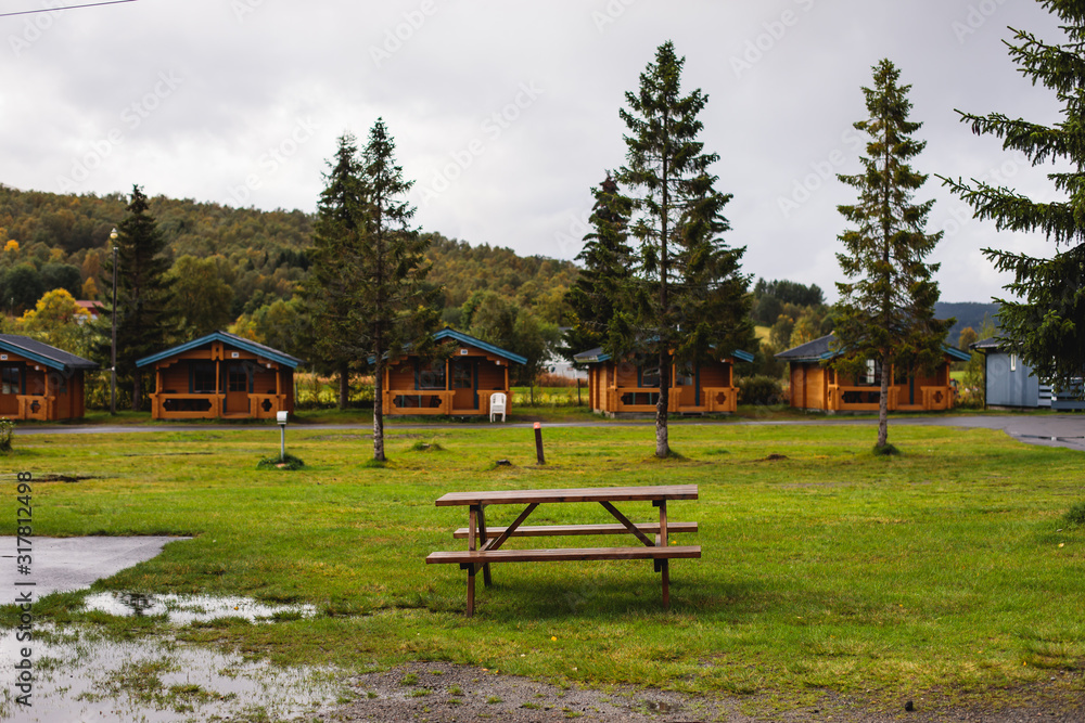 View of Classical Norwegian Camping site with traditional wooden red cottages, Northern Norway View of Classical Norwegian Camping site with traditional wooden red cottages, Northern Norway