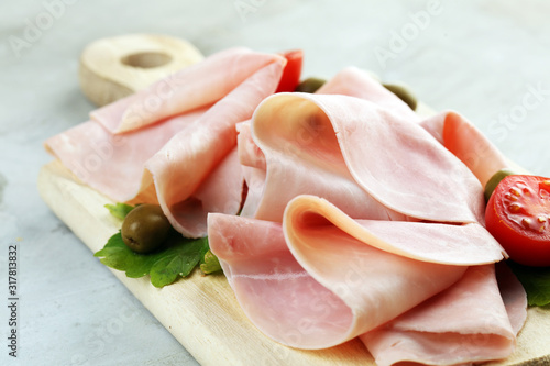 Fotografia Sliced ham on wooden background