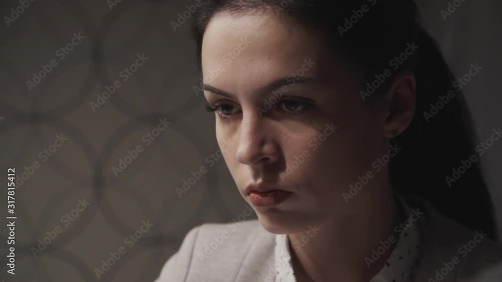Serious and young freelancer woman working inside remute home office, looking away, thinking about new start up. Female with ponder, pensive face wearing in formal wear clothes Serious and young freelancer woman working inside remute home office, looking away, thinking about new start up. Female with ponder, pensive face wearing in formal wear clothes