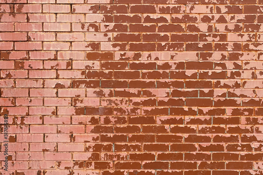Naklejka premium faded red painted brick wall