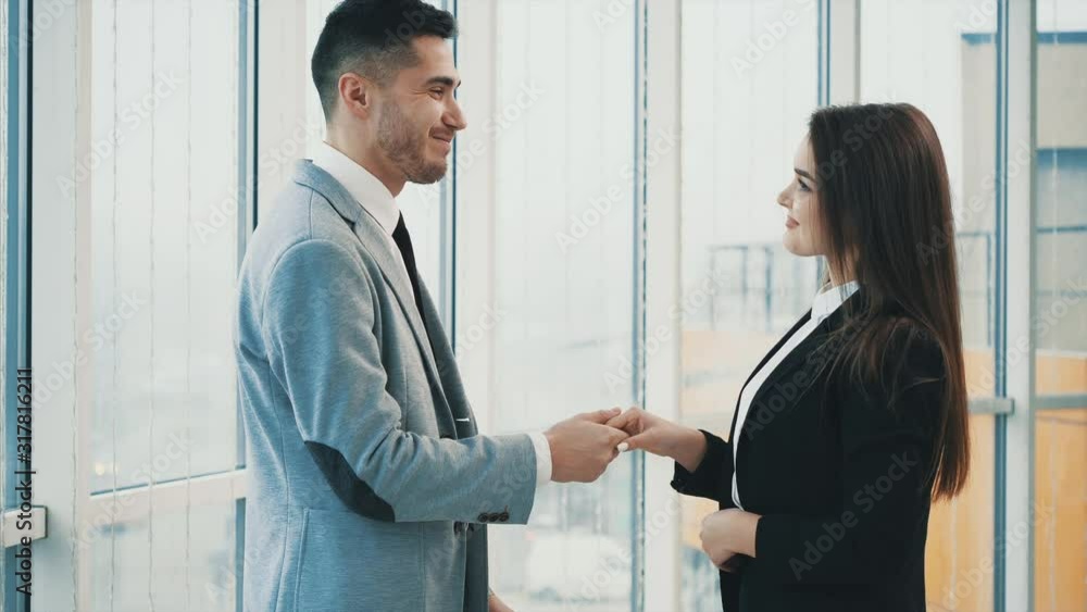 Acquaintance of two business people in office, on the panoramic blurred background. Close up. Copy space. 4K. Acquaintance of two business people in office, on the panoramic blurred background. Close up. Copy space. 4K.