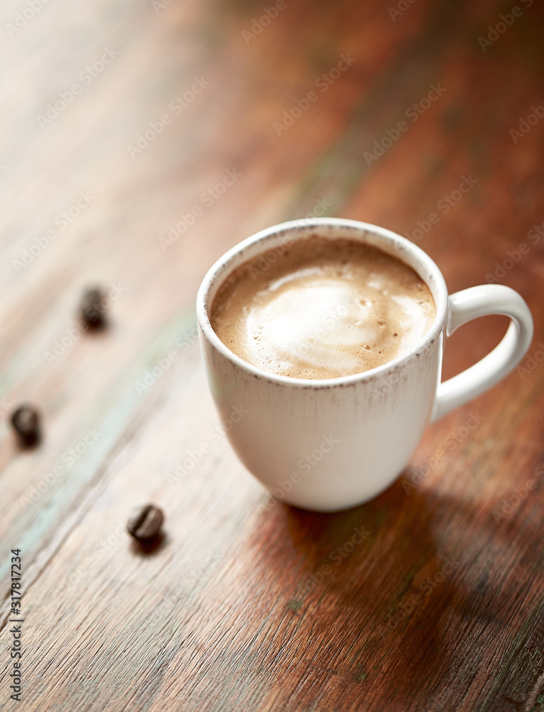 Cup of coffee on rustic wooden background Cup of coffee on rustic wooden background