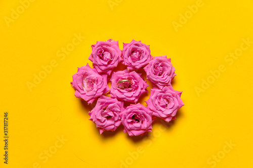 Flowers on plain yellow background copy space