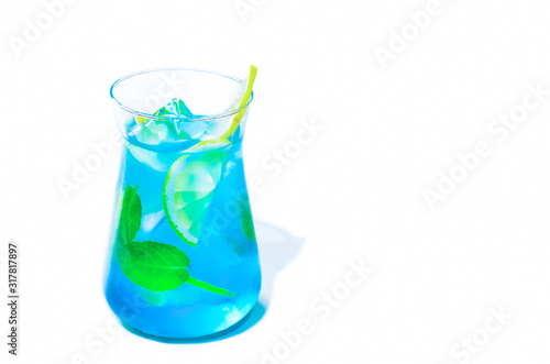 cold summer mint blue cocktail, drink with ice and lemon. in vitro refreshing lemonade. isolate on white.