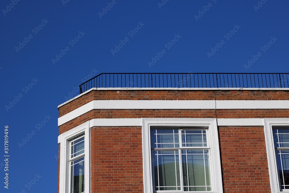 Deep blue sky with corner of building in foreground