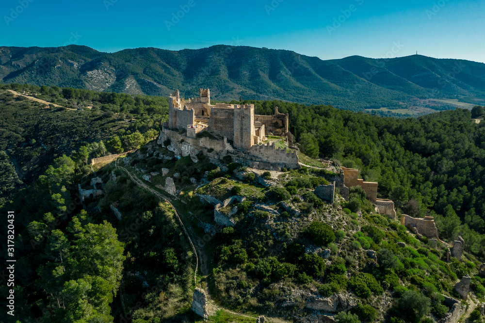 Obraz premium Aerial panorama view of Alcala de Xivert (Alcalá de Chivert) medieval Templar knight castle ruins in Valencia province Spain